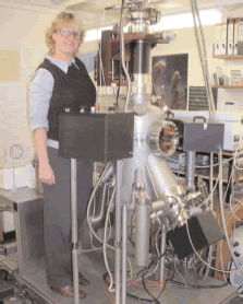 Dr Helen Fraser with the UHV laboratory apparatus of the University of Nottingham